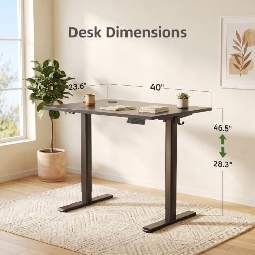 Image of Claiks Electric Standing Desk, 40x24 Inches, Black | Black frame and deep black top, ideal for home office, height adjustable for sitting and standing