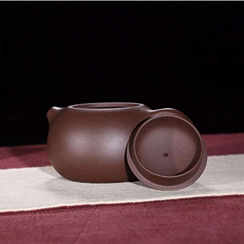 Tetera de cerámica marrón con filtro artesanal que evita hojas sueltas en tu té 5