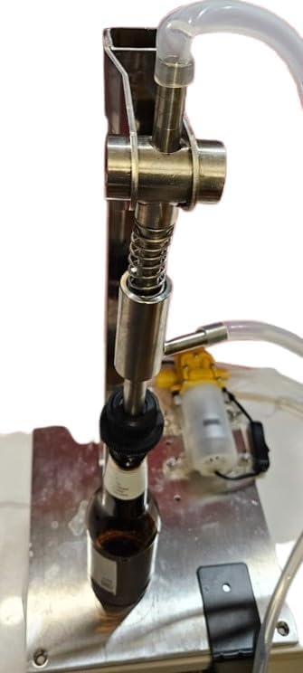 Fermtech Automatic Bottle Fller. For bottling wine, beer, kimbucha, juices, etc. Fill 5 Bottles per Minute. Stainless Steel Design Made in Canada Foods Safe Tubing.