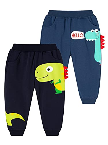 CAMLAKEE Pantalones Deportivos para Bebés De Chándal Joggers Niños Dinosaurio de Dibujos Animados Pantalón Largos Elásticos en Algodón Negro+Armada ES:5-6 años (tamaño del Fabricante: 130) Cover