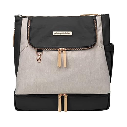 Petunia Pickle Bottom Pivot Backpack | Multiple carrying options (backpack or tote) | Insulated Pockets to Keep you Organized | Modern Silhouette with a Roomy Interior | Sand/Black