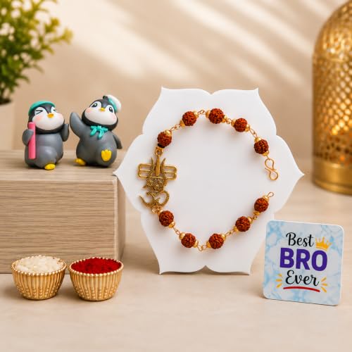 Image of ecraftindia Rudraksha Om Trishul Rakhi Gift Set for Brother | Designer Rudraksha Rakhi with Best Bro Ever Fridge Magnet, Cute Penguin Showpieces & Roli Chawal | Raksha Bandhan Gift Combo
