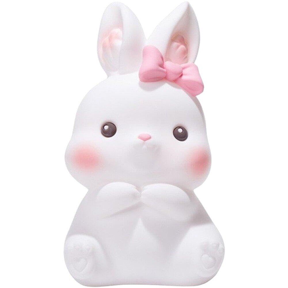 Veilleuse lapin LED rechargeable USB sur la table de chevet d'une chambre d'enfant