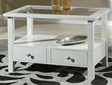 Style : la table basse est composée de 2 tiroirs, de pieds droits et d'un plateau en verre. Un élément d'ameublement qui ne passera pas inaperçu. Idéal pour apporter une touche d'élégance et de luminosité à des environnements peu encombrants.