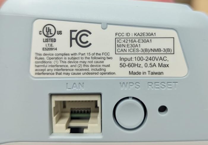 Side view of the D-Link E30 extender showing the WPS/Reset button and LAN port.