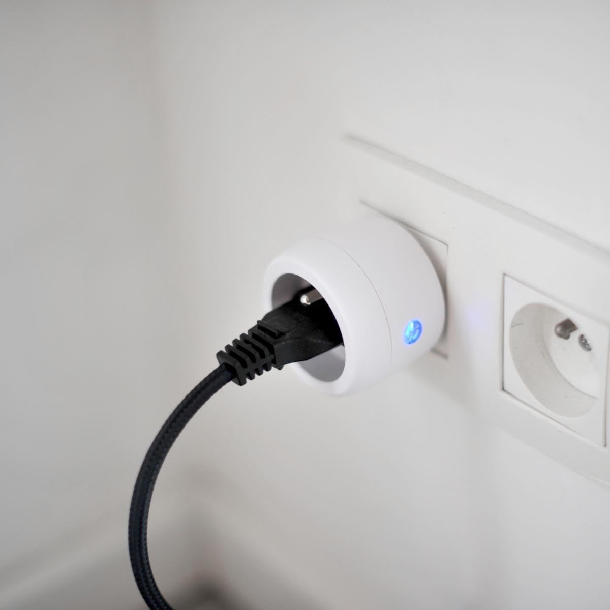CHACON wireless control plug inserted into a wall socket with a device plugged into it