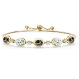 Gem Stone King 18K Yellow Gold Plated Silver Blue Mystic Topaz, Sky Blue Aquamarine and Lab Grown Diamond Bracelet For Women | 4.75 Cttw | Gemstone November Birthstone | Oval 7X5MM | Fully Adjustable