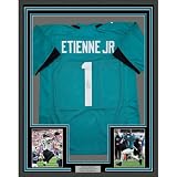 Framed Autographed/Signed Travis Etienne Jr. 35x39 Jacksonville Teal Football Jersey Beckett BAS COA
