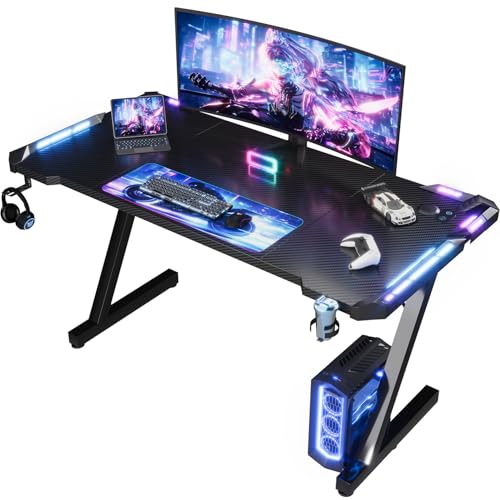 Migliori scrivanie gaming Devoko 120 x 60cm Scrivania Gaming LED, Tavolo Gaming Ergonomica, Scrivania per Computer con Porta Bicchiere e Ganci per Cuffie, Postazione con Piano del Tavolo in Fibra di Carbonio, Nero
