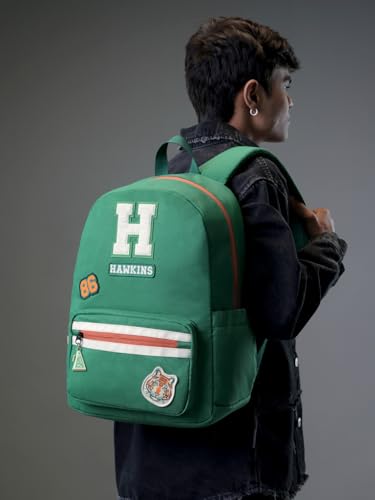 Image of The Souled Store Official Stranger Things Hawkins School Backpack | Green 18L Retro Daypack with 15.6 inch Laptop Sleeve & Embroidered Patches
