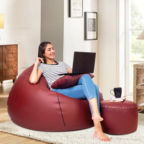 Image of Amazon Brand - Solimo 5XL Faux Leather Bean Bag with Footstool & Cushion Combo for Living Room | Bean Bag Filled with Beans | Capacity Upto 6'7 inch Height & 130 Kg Weight | (Tan with Black Piping)