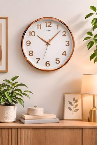Image of Amazon Brand - Solimo 12 Inches Silent Wall Clock for Living Room Bedroom Office Plastic Easy to Read 3D Numbers Modern Stylish Sweep Movement Wall Clock for Home 1603DX (Rose Gold)