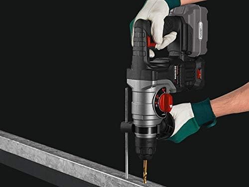 User drilling into a metal beam with the rotary hammer drill