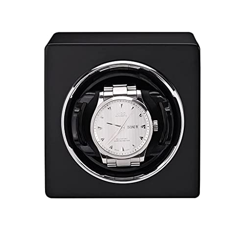 Relojes mecánicos organizados en esta caja de cuero sobre la cómoda