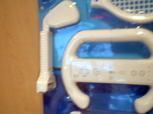 Zenex on the Move Wii Gaming Accessories 7-in-1 Sports Pack Blister Package Version Model#301-9713 for Nintendo Wii System---comes with Wii Tennis Racquet, Wii Golf Club, Wii Baseball Bat, Wii Pistol, Wii Steering Wheel, Wii Remote Grip, & Wii Remote Handle---user Friendly Snap-in Design Comfortable Converts Wii Controller Into 6 Different Gaming Kits---each of the Sets Are for Use with Compatible Wii Console Game. The Accessories Set Help Simulate the Corresponding Game Actions. (Nintendo Wii System Console Version)