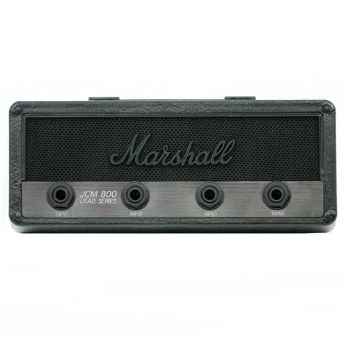 Include 4 portachiavi con presa per chitarra