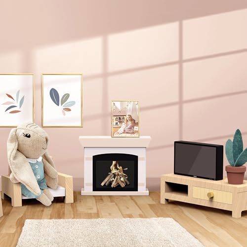 Miniature dollhouse living room with a gray rabbit character, white fireplace, small television stand, framed pictures, plant, and cream rug.