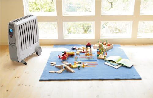 Dimplex CADIZ Oil Heater placed in a living room setting with toys