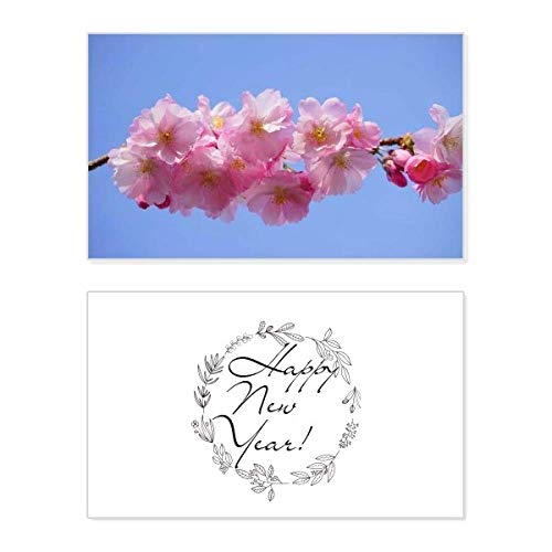 Tarjeta conmemorativa de Año Nuevo de flores azul y rosa para decorar tu mesa de nochevieja