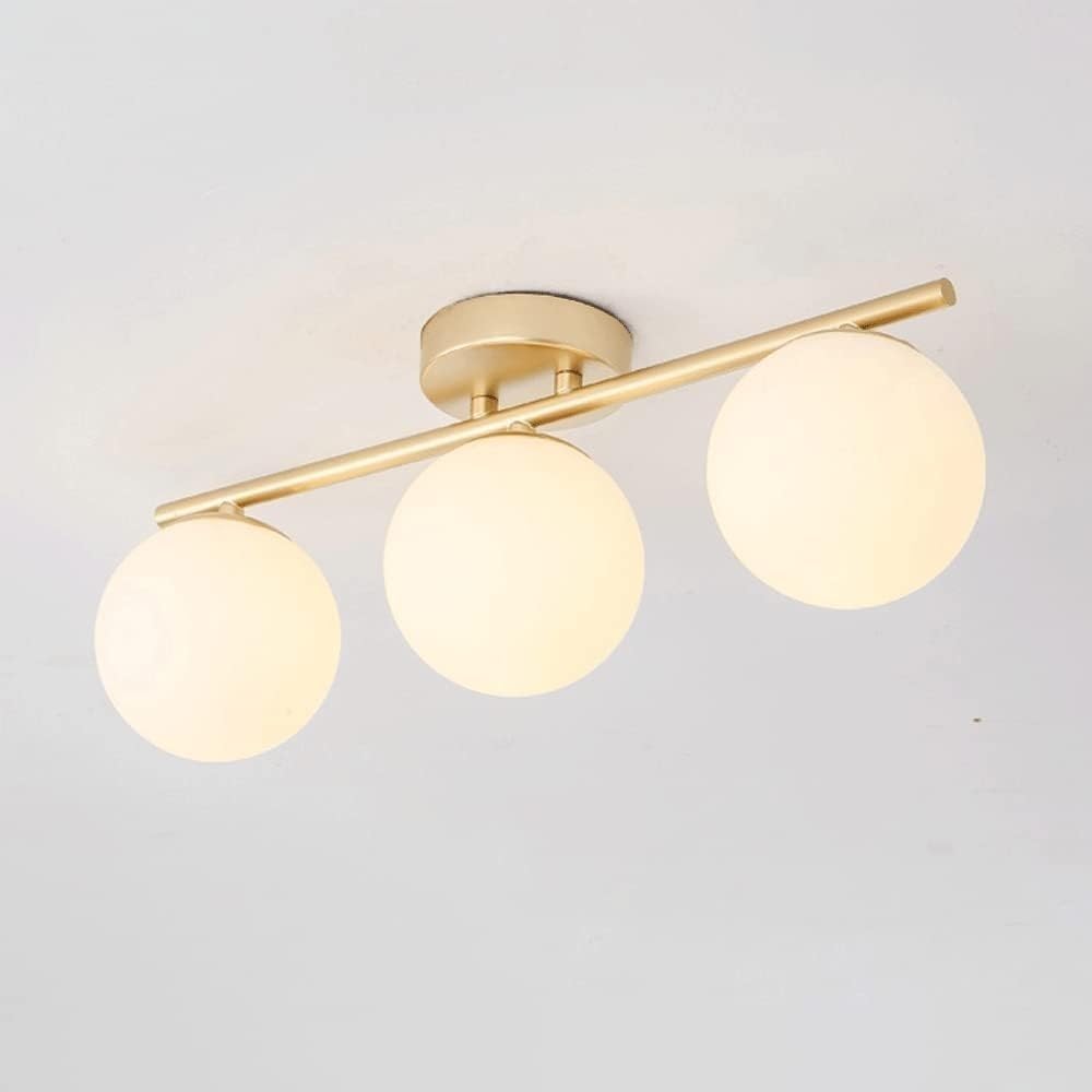 Lámpara de araña minimalista con esferas de vidrio opalino y acabado dorado