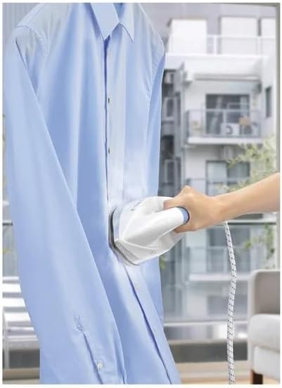 Person using the steam iron for vertical steaming on a hanging shirt