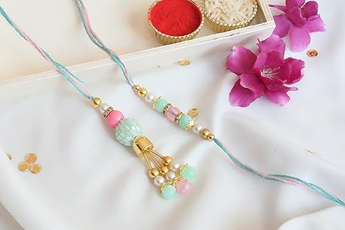 UtsaWe Rakhi Gift Box | Rakhi Hamper with Fancy Multi Color Bhaiya Bhabhi Rakhi, Roli, Chawal, Mini Thali Set, A Chocolate, And A Greeting Card (Multi Color Bead Couple Rakhi)3