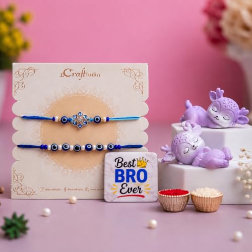 Image of eCraftIndia Designer Blue Evil Eye Rakhi for Brother with Best Bro Ever Fridge Magnet, Cute Purple Deer Showpieces, Roli Chawal, Premium Raksha Bandhan Gift Set