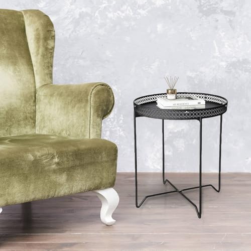 Table ronde en métal noir comme bout de canapé discret