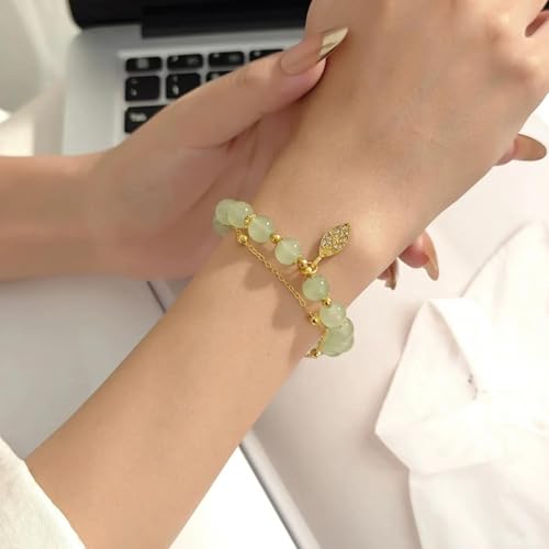 Pulsera de hojas doradas con doble cadena para lucir en eventos 2