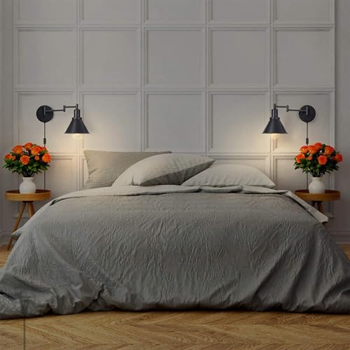 Lámpara de pared giratoria industrial para crear un rincón de lectura acogedor en el dormitorio