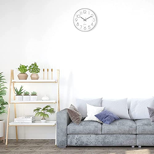 Horloge murale moderne au design rond argenté épuré