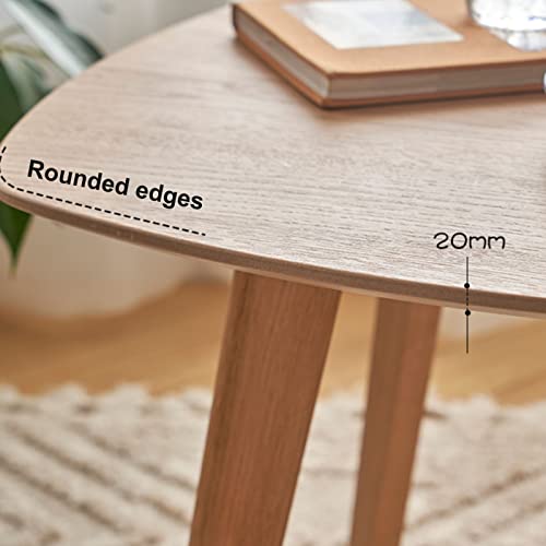 Petite table basse ronde en bois massif avec pieds robustes
