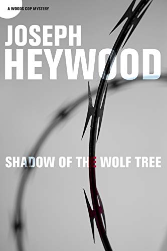 Shadow of the Wolf Tree: A Woods Cop Mystery
