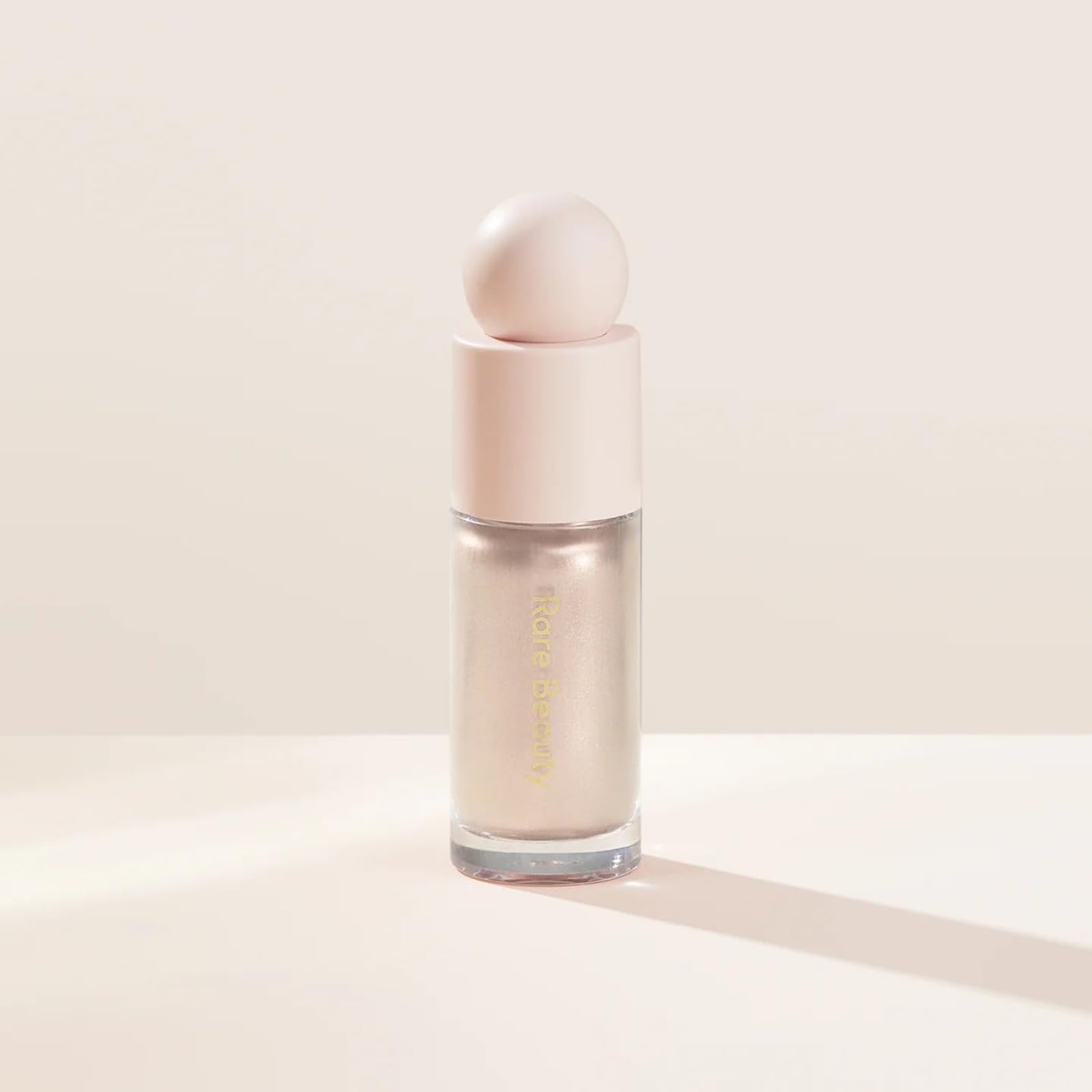 Rare Beauty Positive Light Dewy Highlighter, Face Highlighter Bronzer Makeup Stick für Gesicht und Körper (Enchant)