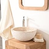 webcam stromboli 1 [Design et utilisation] Optez pour le chic et le naturel de la vasque en marbre Stromboli dont la géométrie originale et l 'extérieur brut bouchardé sauront vous séduire.