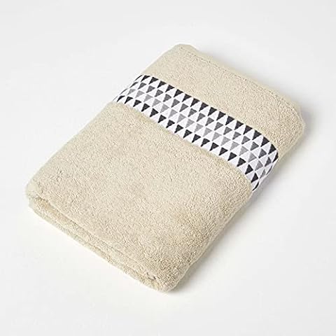 HOMESCAPES Beige Bath Towel with Retro Design Cover