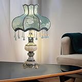 MATÉRIAUX NOBLES: Base en Résine avec finition bronze antique, ornée de fleurs peintes à la main et de motifs sculptés élaborés