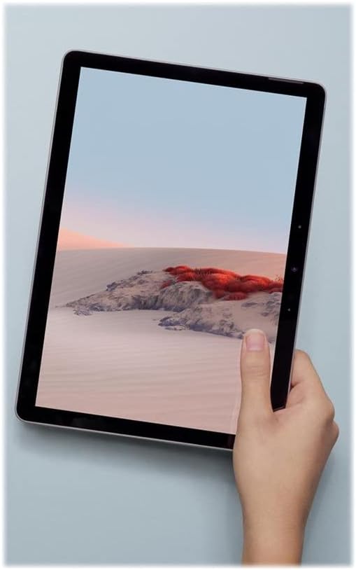 Microsoft Surface Go 2 LTE Tablet held vertically in a hand, displaying a portrait image.