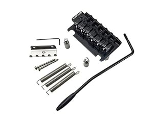 Patented eCAM saddle technology Z-Series single saddle lock screw design Individual string height adjustment Steel Babicz logo plate 2 1/16th String spacing