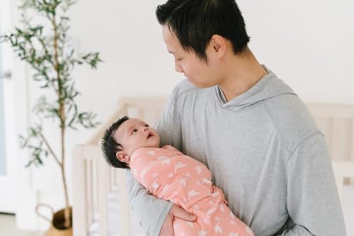 Image of KicKee Swaddling Blanket, Made from Luxuriously Soft KicKee Signature Blend Fabric, Buttery Softness for Snuggling Your Baby (Blush Stork - One Size)