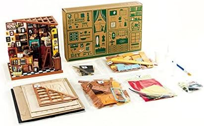 Contents of the Robotime DG102 kit laid out, including wooden sheets, paper cutouts, fabric pieces, small accessories, glue, and a brush.