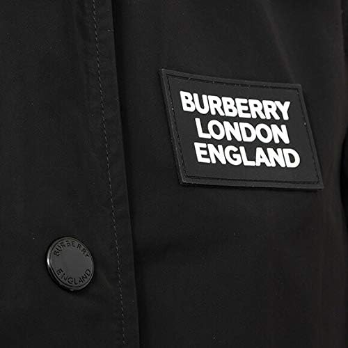 Close-up of the 'BURBERRY LONDON ENGLAND' rubber logo on the chest of the coat.