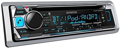 Marine stereo receiver installed on a boat dashboard with a smartphone connected