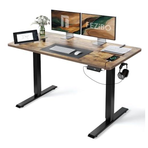 FEZIBO 55 x 24 Inches Standing Desk with Drawer, Adjustable Height Electric Stand up Desk, Sit Stand Home Office Desk, Ergonomic Workstation Black Steel Frame/Rustic Brown Tabletop