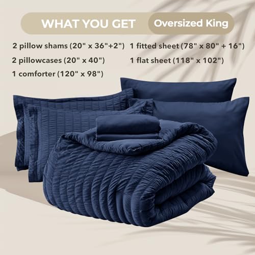 Image of HYMOKEGE Navy Blue Oversized King Comforter Set Seersucker 7 Pieces, All Season Luxury Bed in a Bag for Bedroom, Bedding Set with Comforter, Sheets, Pillowcases & Shams