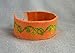 Handmade embroidered bracelet with green leaf