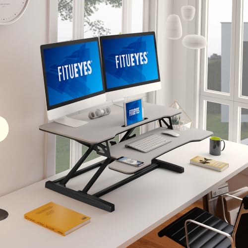 Image of FITUEYES Height Adjustable Standing Desk 36 inch Wide Sit to Stand Converter Stand Up Desk Tabletop Workstation for Laptops Dual Monitor Riser White SD309103WW
