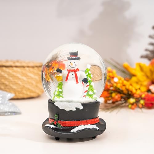 Muñeco de nieve en globo de nieve de Navidad y bola musical de cristal