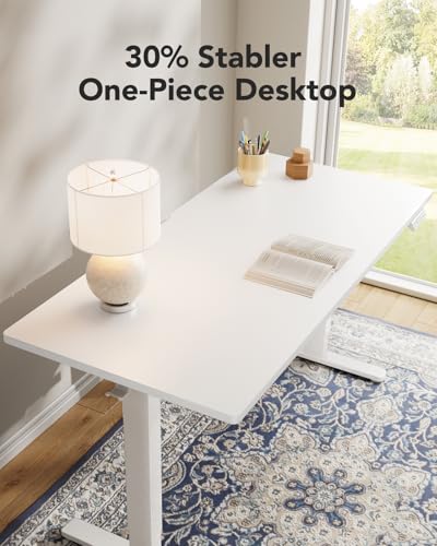 Image of HUANUO Electric Standing Desk, Whole Piece Desktop, Adjustable Height Computer Desk, 4 Height Memory Settings, Sit Stand Up Desk for Home Office, 60 inch x 24 inch, White