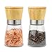 Set salero y pimentero. Juego de 2 molinillos para sal y pimienta o especias, con tapa de madera y cuerpo de cristal con detalles en acero. Pack de molinillos ideal para cocina